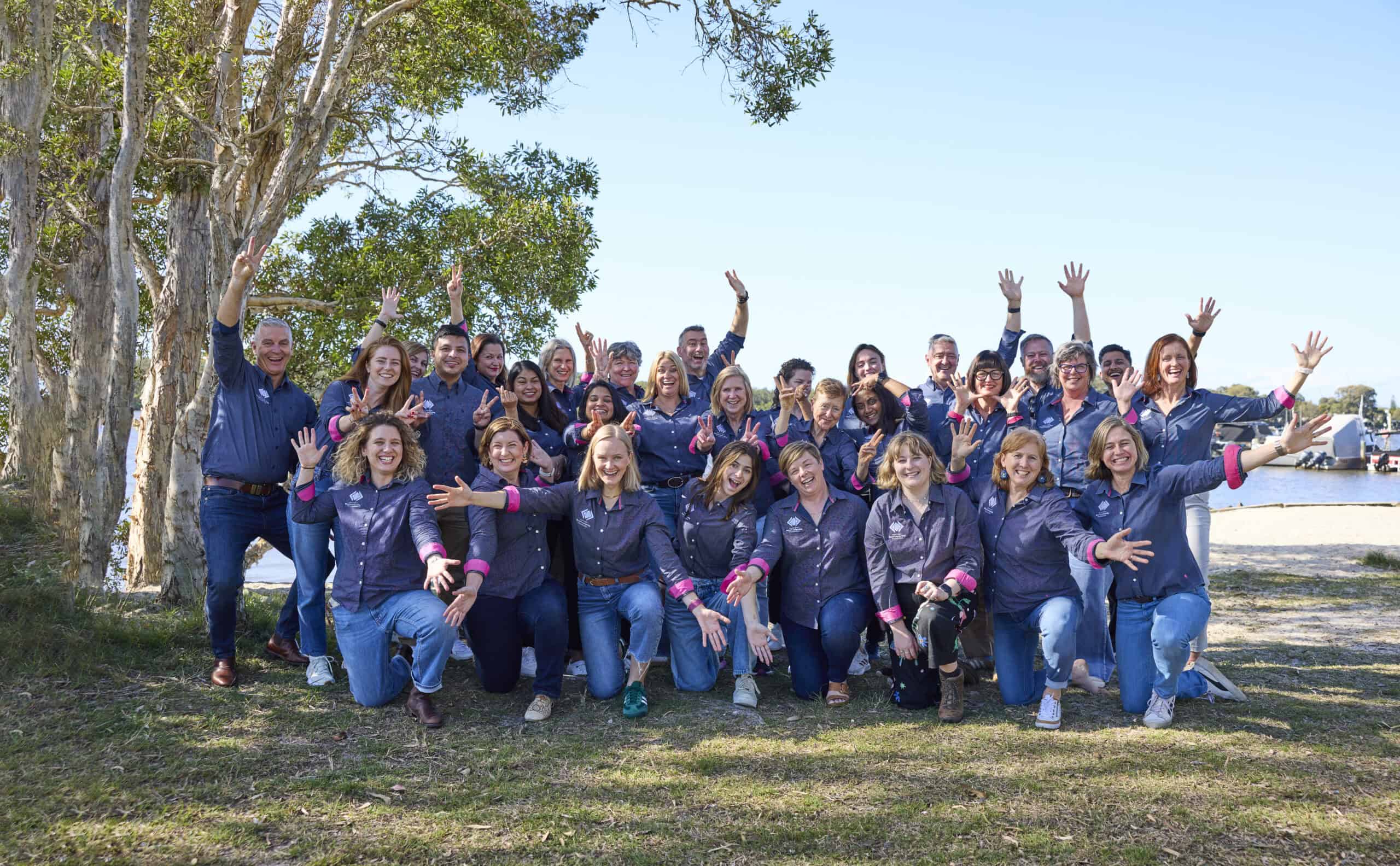 Group photo of staff looking happy