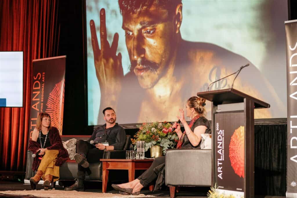 A speaker panel on stage at the 2021 Artlands festival.