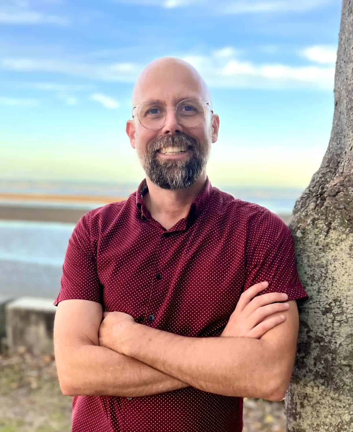 Photo of Benny Callaghan smiling with sunset behind