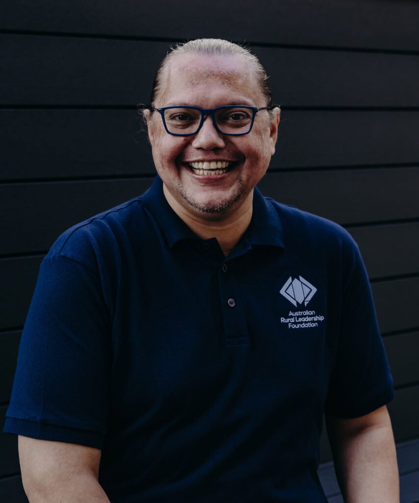 First Nations ARLP participant smiling at camera in ARLF shirt