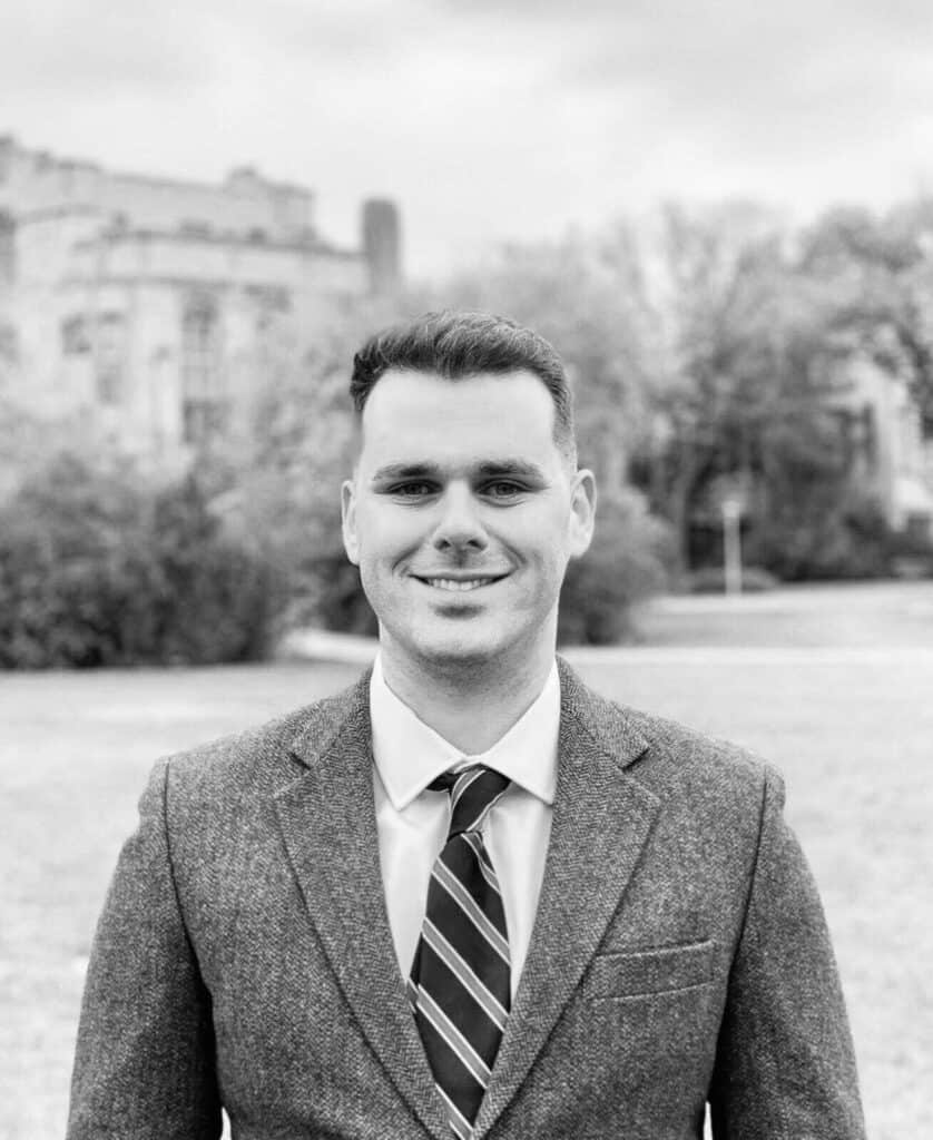 Black and white photo of man in a blazer