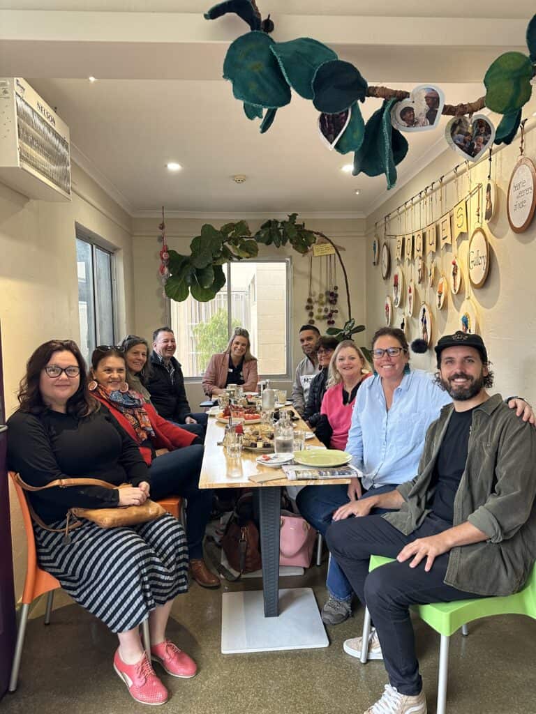 Group of people sitting at a cafe