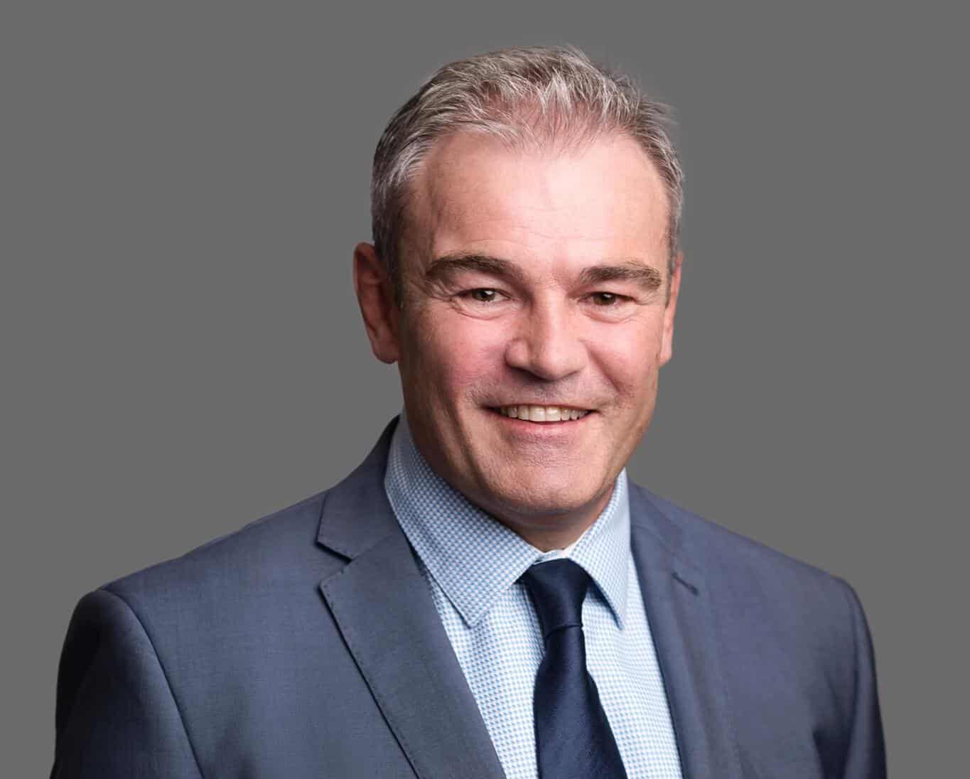 A portrait of John Maher.