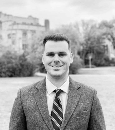 Black and white photo of man in a blazer