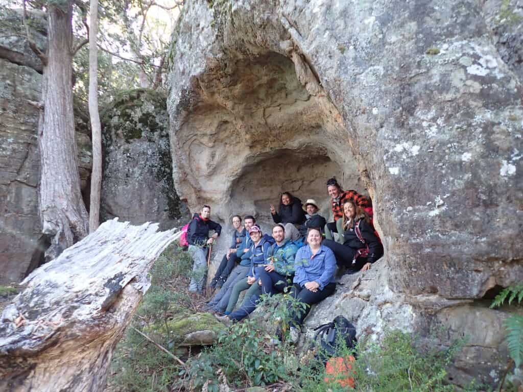 Group of people sitting in a cave